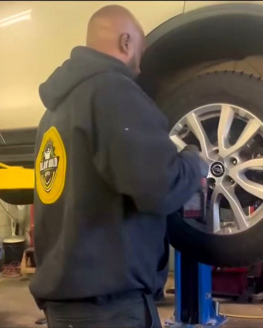 Abdul working on a wheel at Black Gold Auto